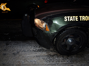 photo showing damaged front of state police cruiser