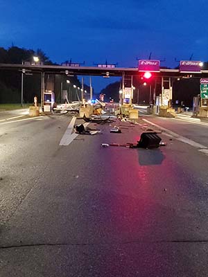 photo showing crash debris at rochester toll plaza