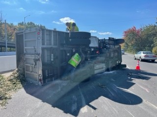 photo showing under side of overturned dump truck