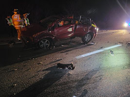 photo showing damaged vehicle at crash scene