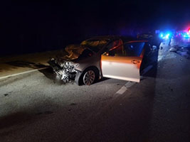 photo showing damaged vehicle at crash scene