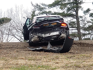 photo showing damaged rear of state police cruiser