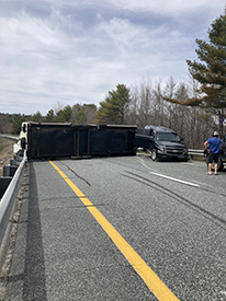photo of overturned camper and vehicle blocking interstate 89