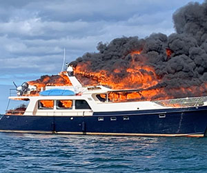 photo of flames on burning boat