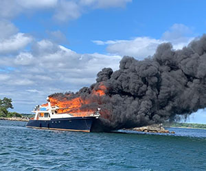 photo showing boat on fire